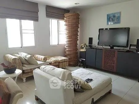 Spacious living room with modern furniture and natural light