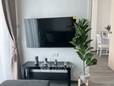 Modern living room with wall-mounted TV and stylish decor