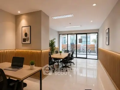 Modern office space with sleek design and natural light, featuring stylish furniture and decor.