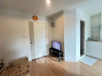 Cozy apartment interior with modern kitchen and wooden flooring