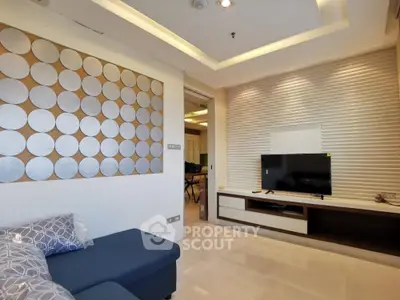 Modern living room with stylish wall decor and sleek TV unit