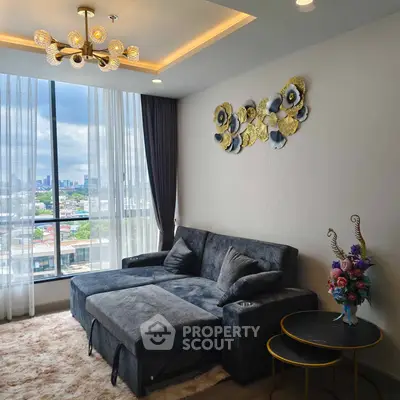 Luxurious living room with plush sofa and city view, perfect for relaxation.
