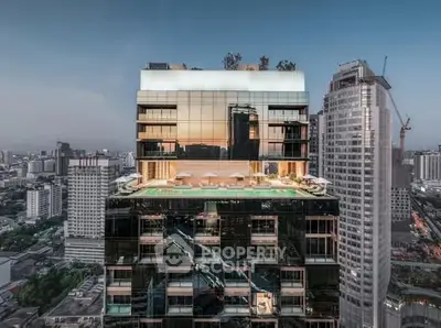 Stunning rooftop pool with panoramic city views on a modern high-rise building.