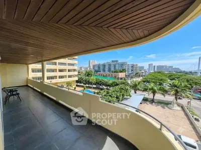 Spacious balcony with stunning city view and modern design, perfect for relaxation and entertainment.