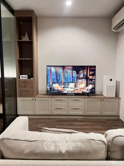 Modern living room with stylish TV unit and cozy seating area