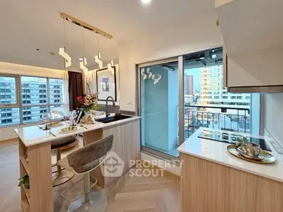Modern kitchen with open layout and city view, featuring stylish lighting and elegant dining setup.
