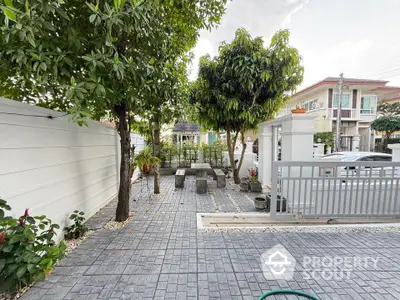 Charming garden patio with stone seating in modern residential area