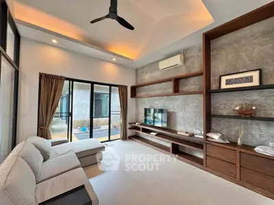 Modern living room with sleek design, large windows, and stylish furniture.