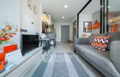 Modern living room with stylish decor and open kitchen layout