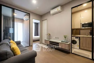 Modern apartment interior with cozy living room, stylish kitchen, and inviting bedroom.