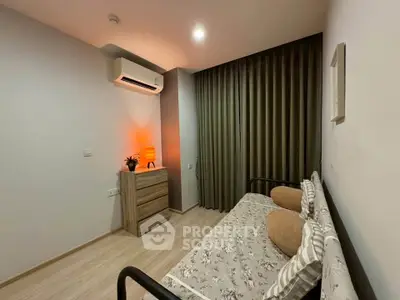 Cozy bedroom with modern decor and air conditioning
