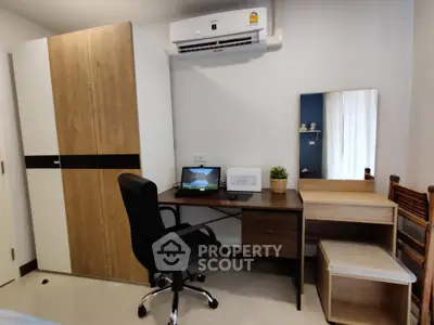 Modern study room with desk, chair, and wardrobe in stylish apartment
