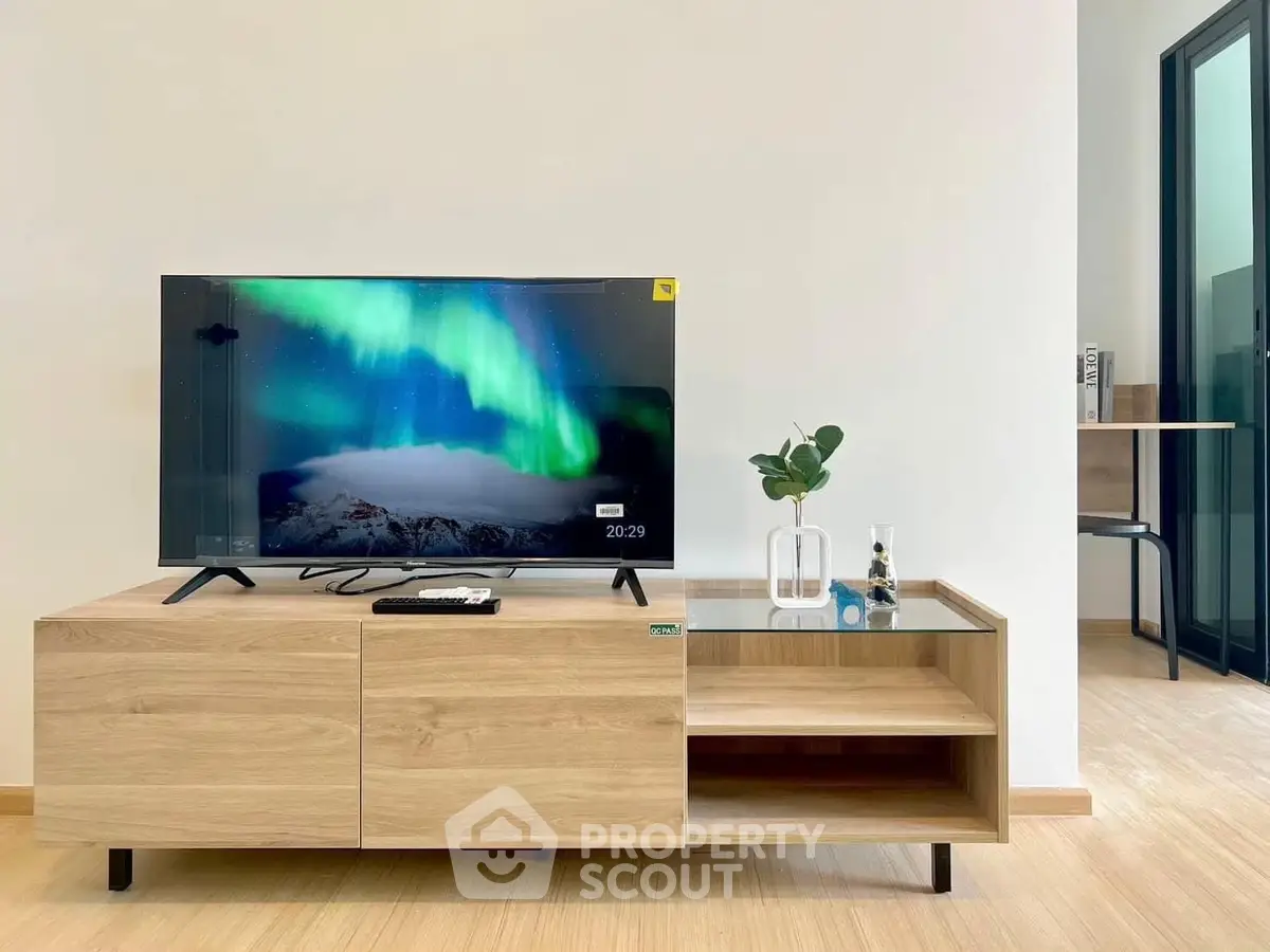 Modern living room with sleek TV stand and vibrant decor