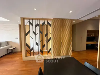 Modern living room with stylish wooden partition and elegant decor