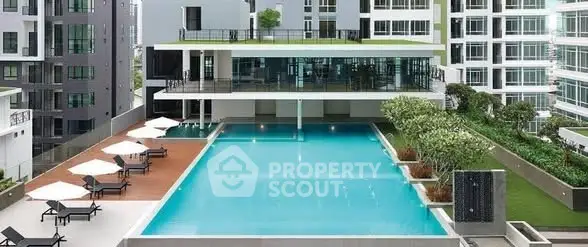 Luxurious condominium with a stunning pool and modern architecture, perfect for urban living.