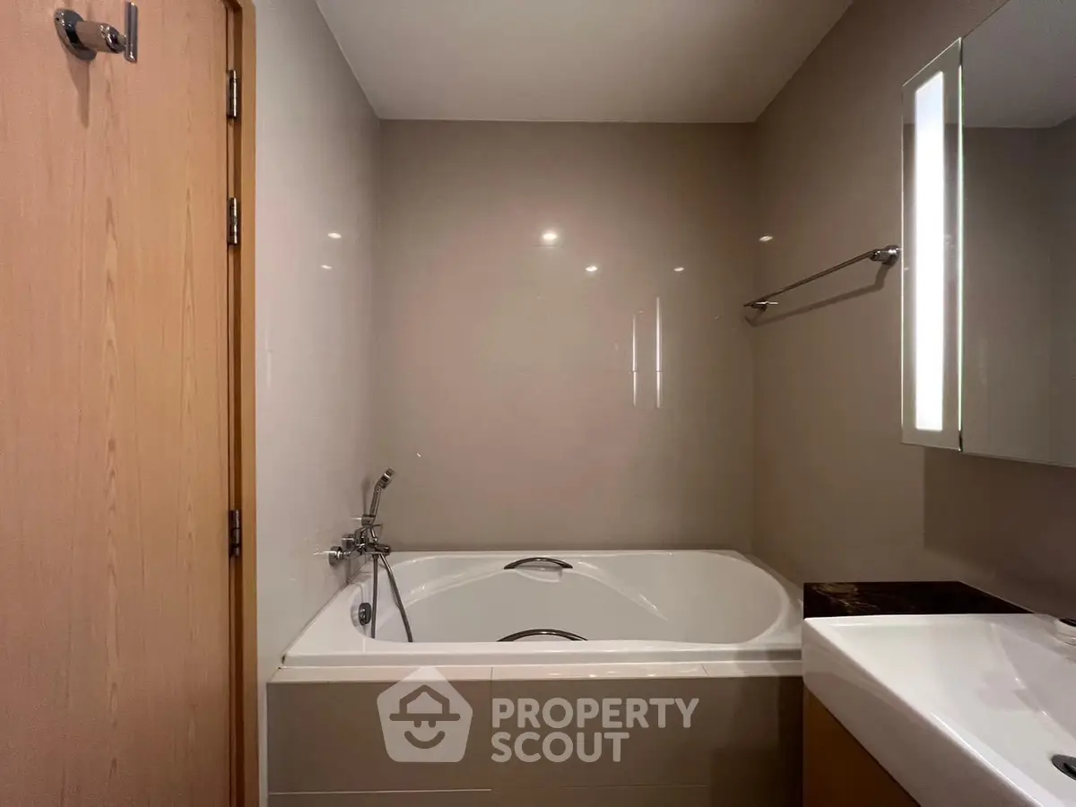 Modern bathroom with sleek bathtub and elegant fixtures