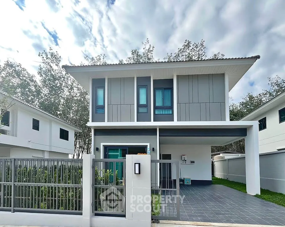 Modern two-story house with sleek design and spacious driveway
