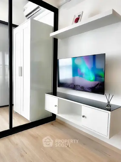 Modern living room with sleek TV setup and stylish storage solutions