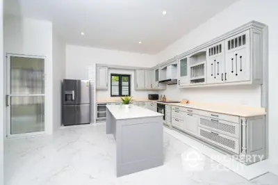 Spacious modern kitchen with sleek cabinetry and island