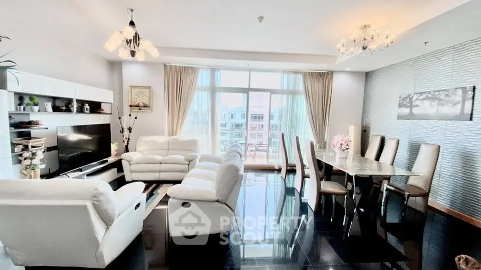Luxurious living room with elegant dining area and large windows offering stunning views.