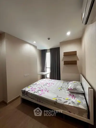 Cozy bedroom with modern decor and natural light, perfect for relaxation and comfort.