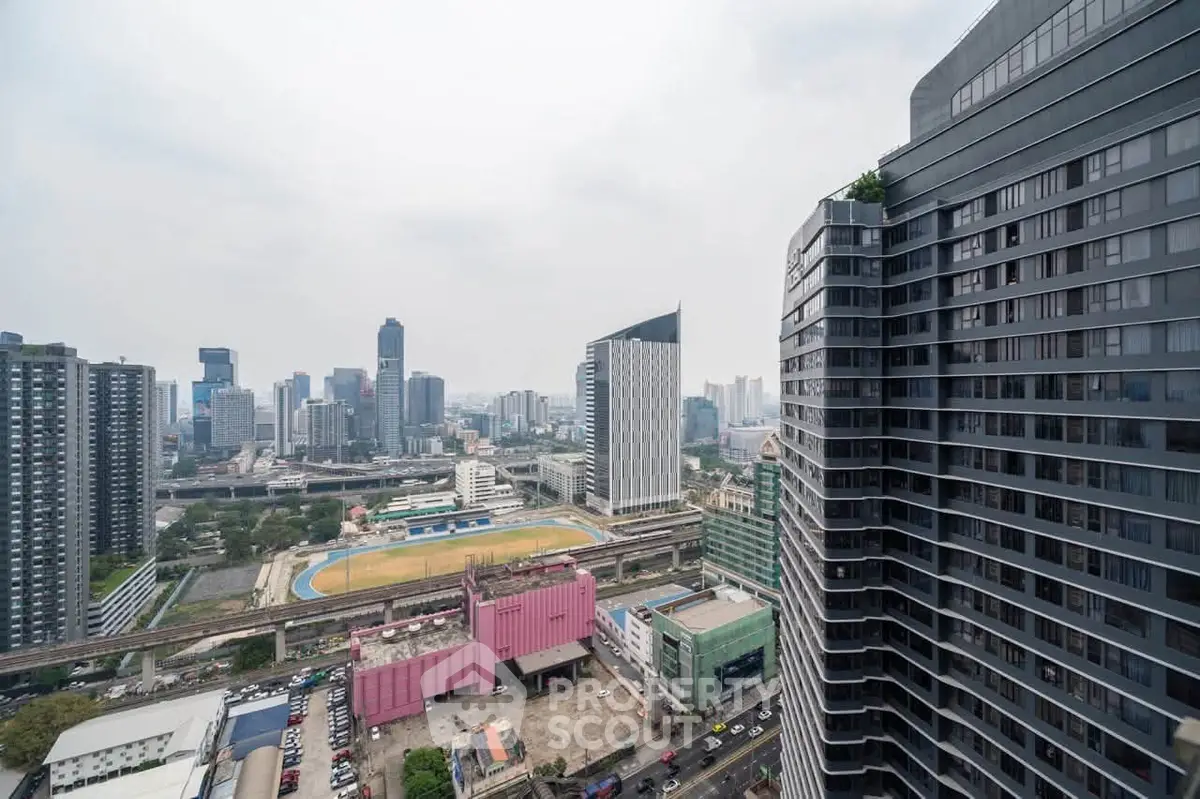 Stunning cityscape view from high-rise building showcasing urban skyline and modern architecture.