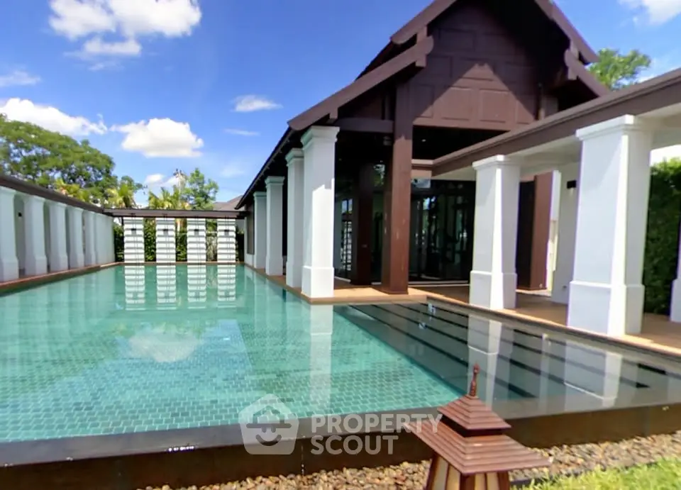 Luxurious villa with stunning pool and elegant architecture, perfect for serene living.