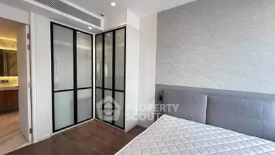 Modern bedroom with sleek wardrobe and stylish decor