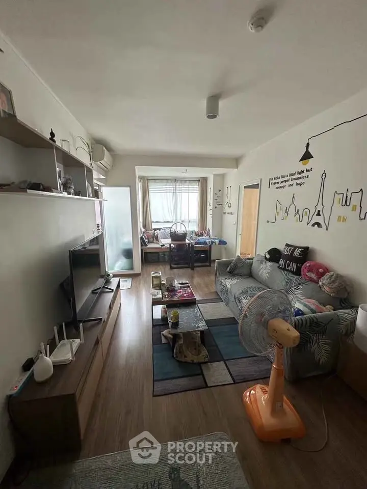 Cozy living room with modern decor and ample natural light