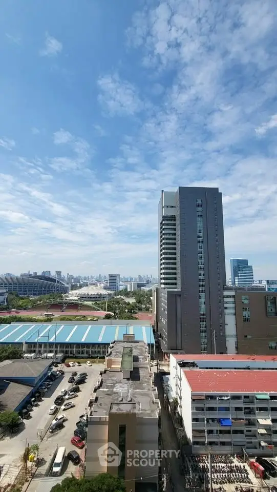 Stunning cityscape view with modern high-rise buildings under a clear blue sky.