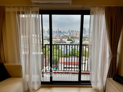 Stunning city view from a modern apartment balcony with elegant curtains.