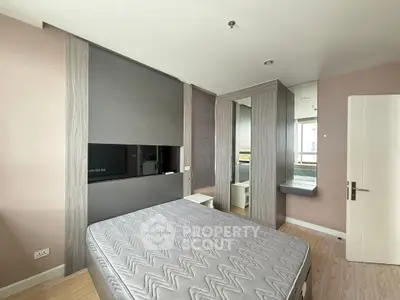 Modern bedroom with sleek design and natural light, featuring a comfortable mattress and stylish decor.