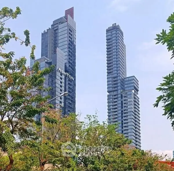 Stunning high-rise buildings with modern architecture and lush greenery in urban setting.