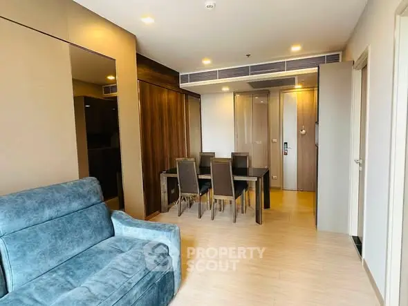 Modern living room with stylish dining area and cozy seating in a contemporary apartment.