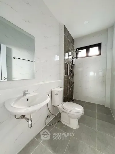 Modern bathroom with sleek design and tiled shower area