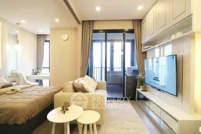 Modern studio apartment with stylish decor and balcony view