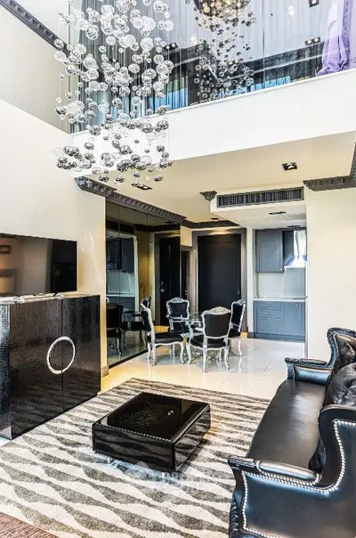 Luxurious modern living room with elegant chandelier and stylish furniture