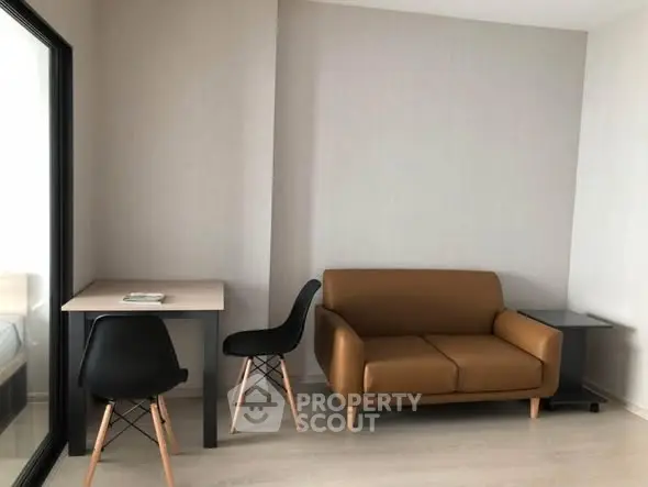 Modern apartment interior with stylish sofa and dining area