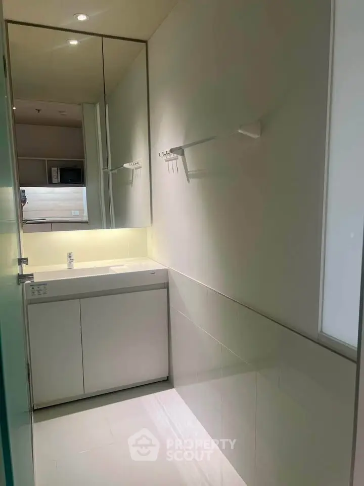 Modern bathroom with sleek design and ample lighting