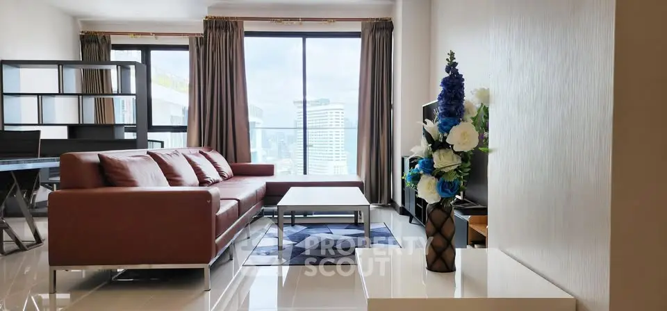 Modern living room with city view, stylish furniture, and elegant decor