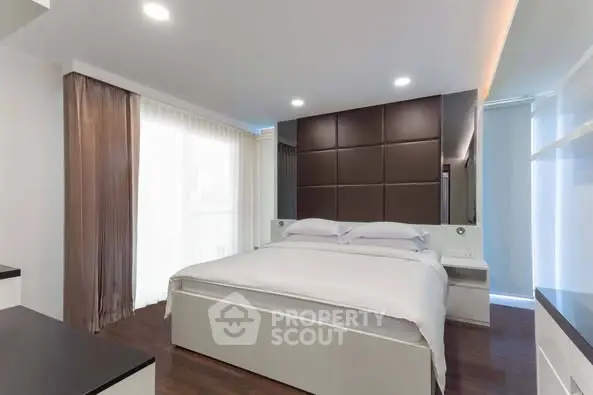 Modern bedroom with elegant design and ample natural light