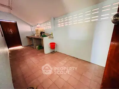 Spacious storage room with tiled floor and ample shelving