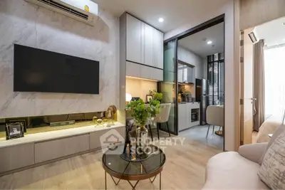Modern living room with open kitchen, sleek design, and stylish decor