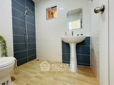 Modern bathroom with sleek design and stylish tiles