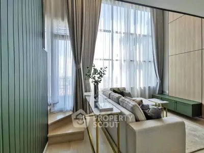 Luxurious living room with high ceilings and modern decor