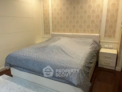 Cozy bedroom with elegant wallpaper and modern furnishings