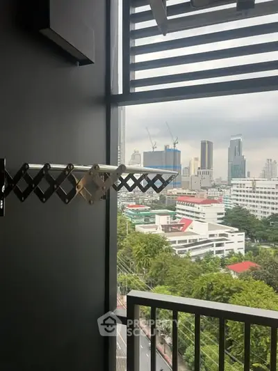 Urban balcony with city skyline view and modern railing