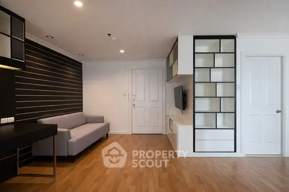 Modern living room with sleek design and built-in shelving