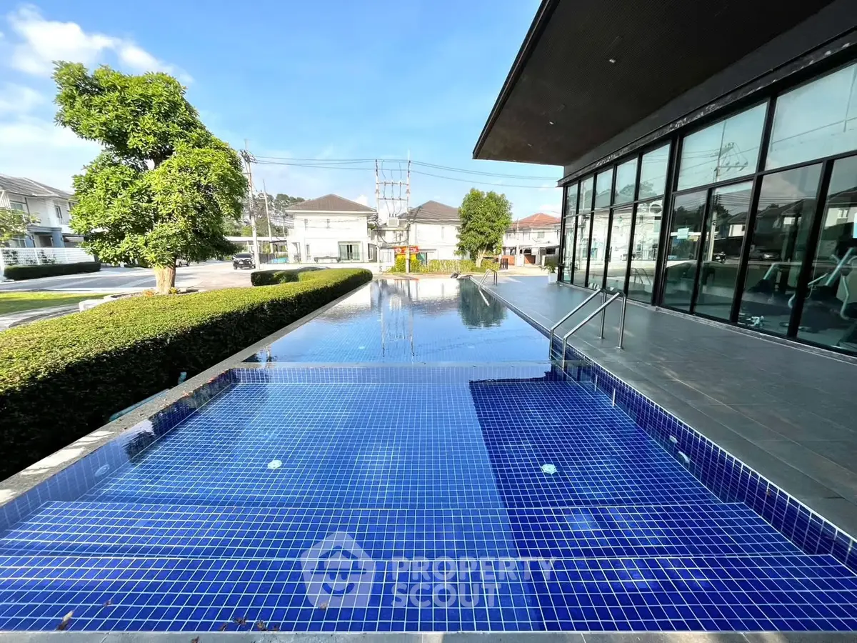 Luxurious residential pool with modern design and serene surroundings, perfect for relaxation and leisure.