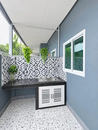 Modern outdoor kitchen with sleek design and mosaic backsplash